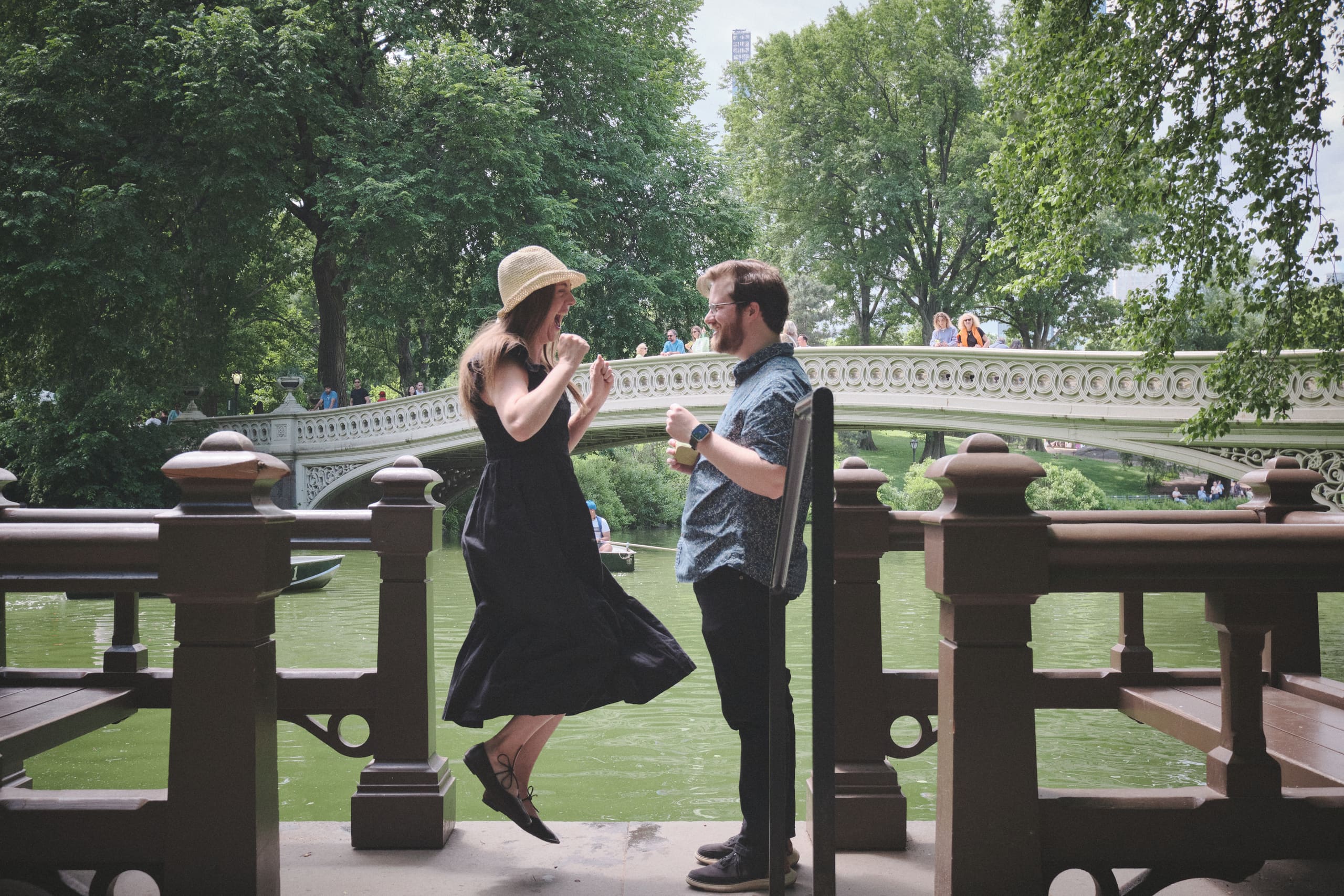 Jumping for joy just after the proposal at Bow Bridge