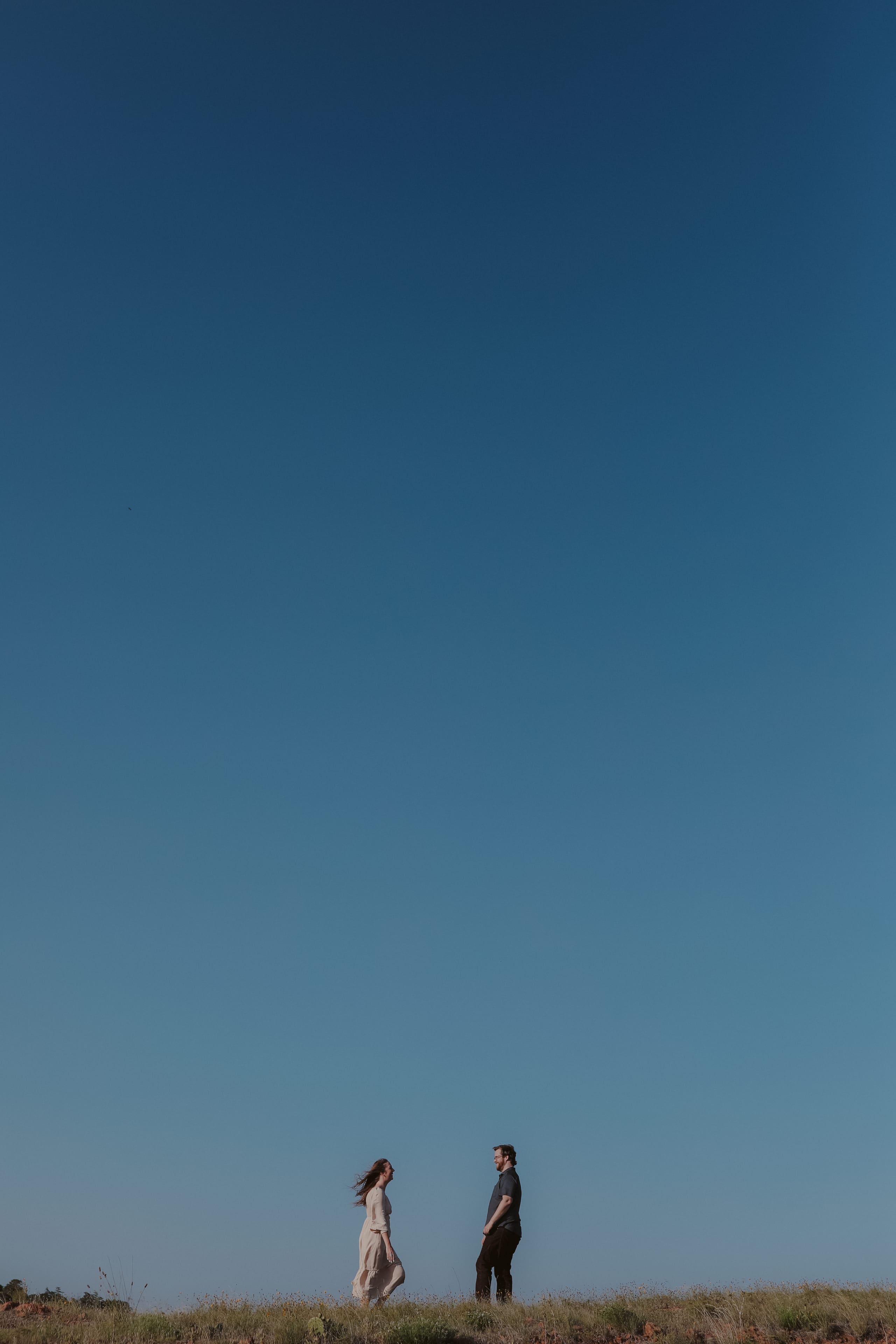 Face to face on the ridge beneath an endless blue sky