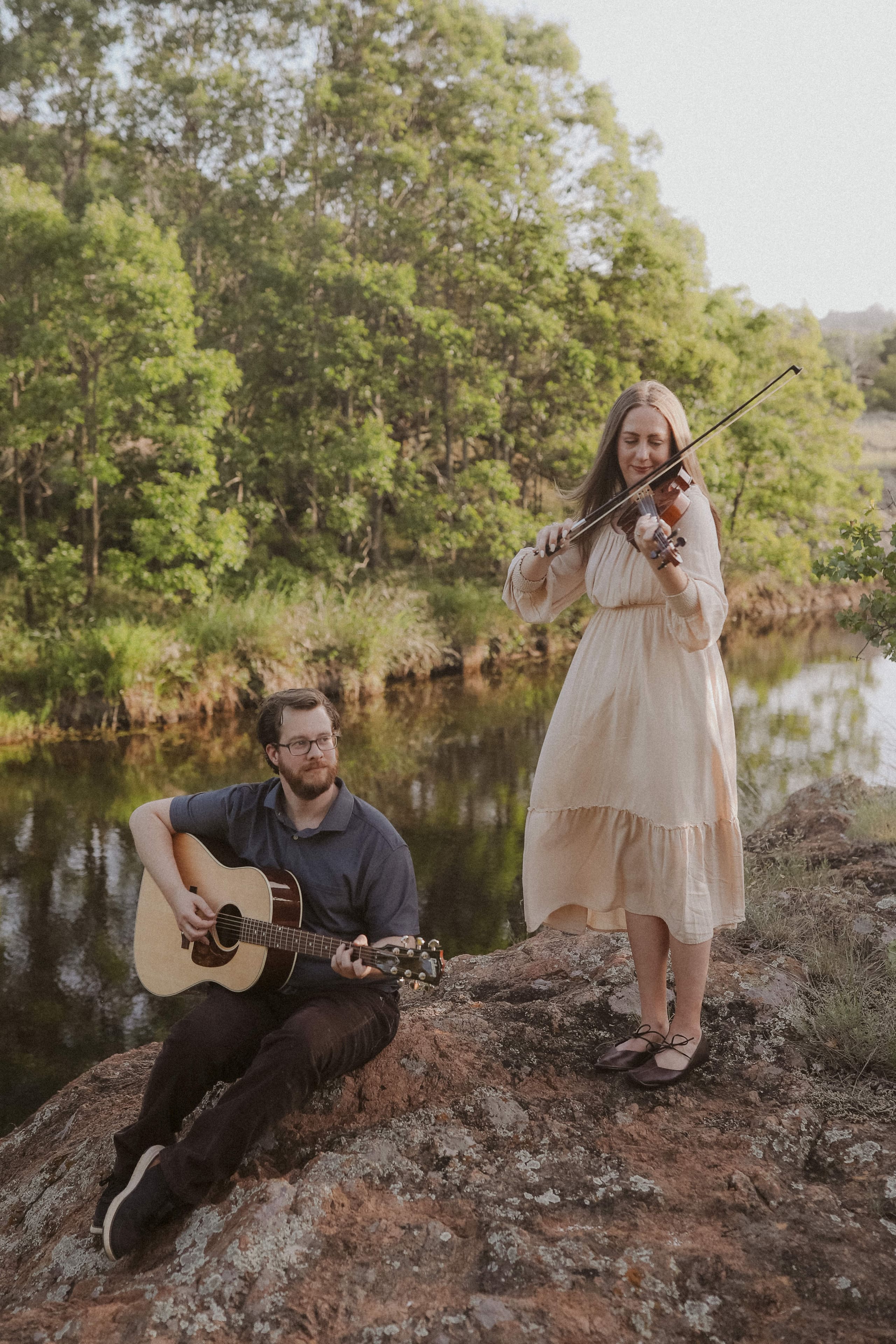 Guitar and violin in harmony above the quiet river