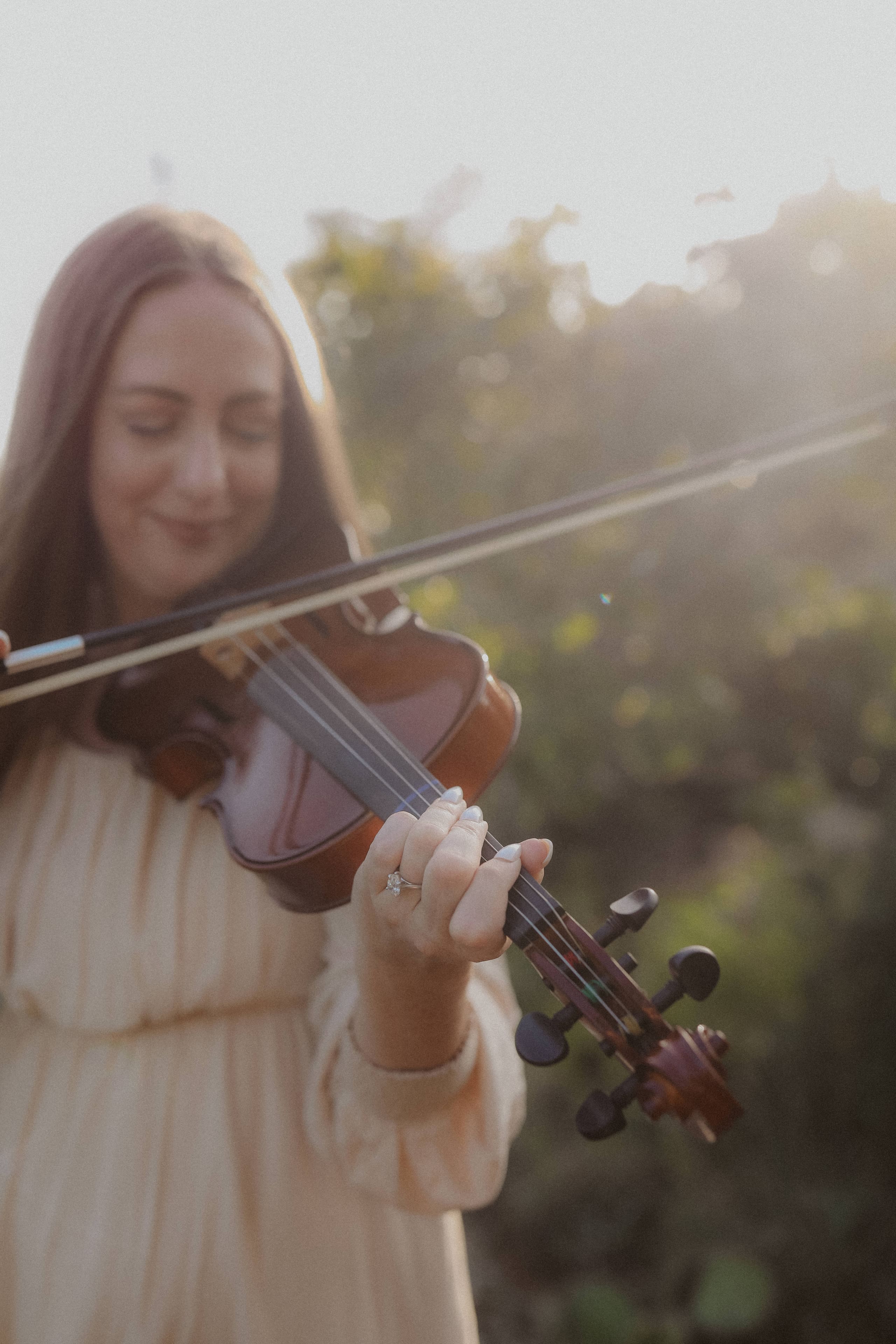 Playing the violin in soft evening light