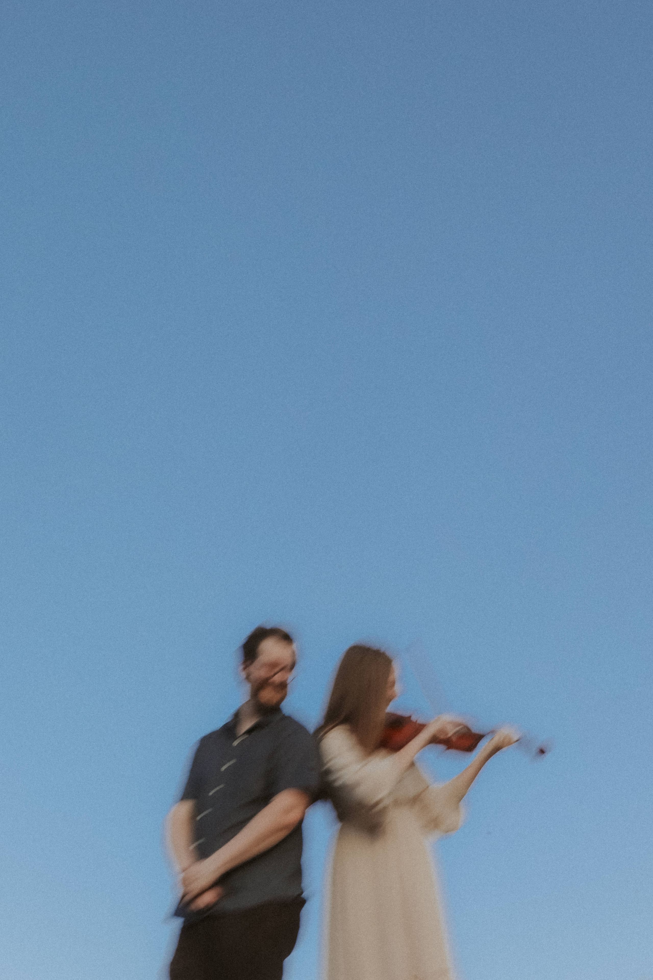 A soft blur of motion — violin song against the evening sky