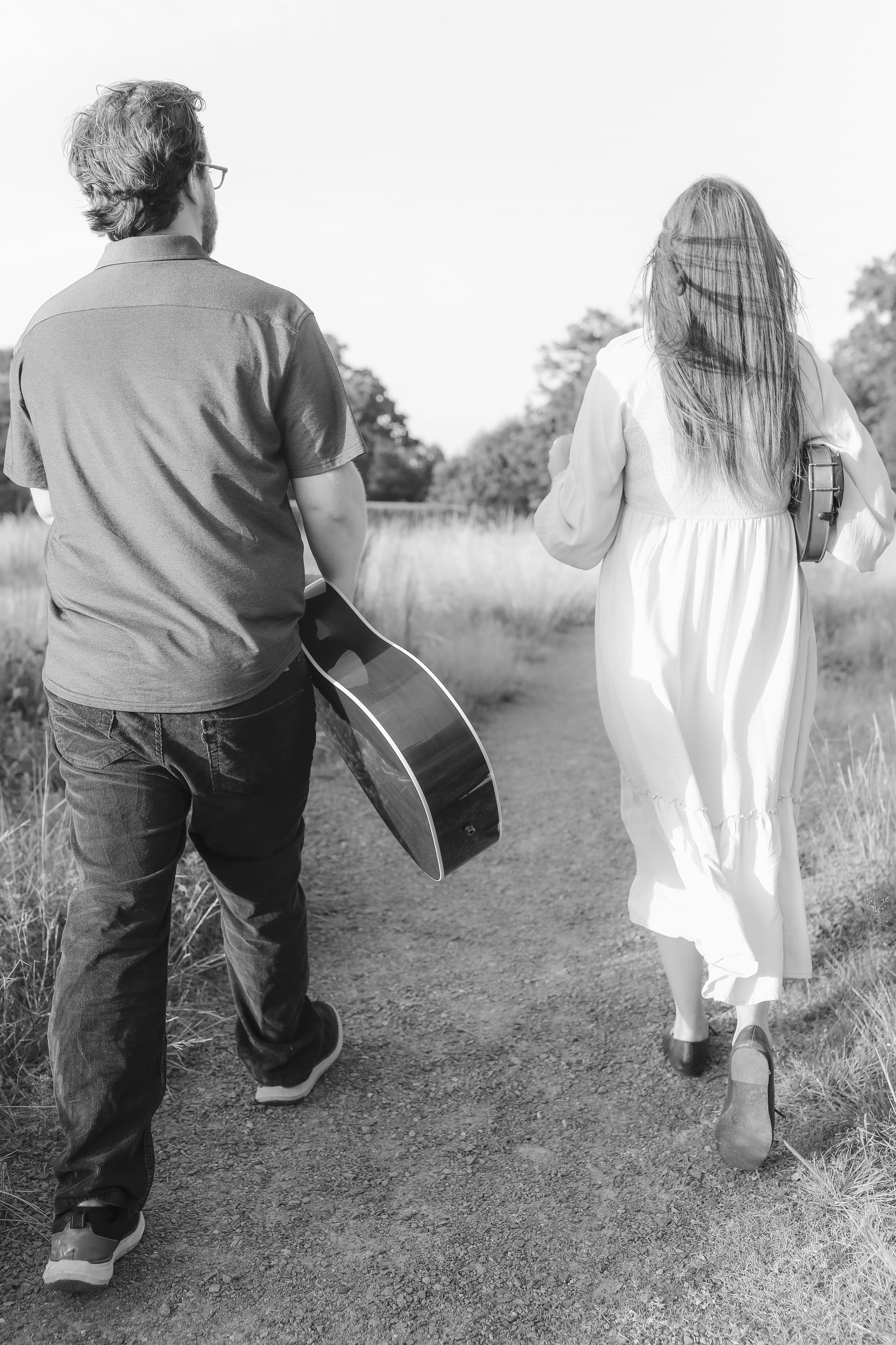 Side by side down the path, instruments in hand, in black and white