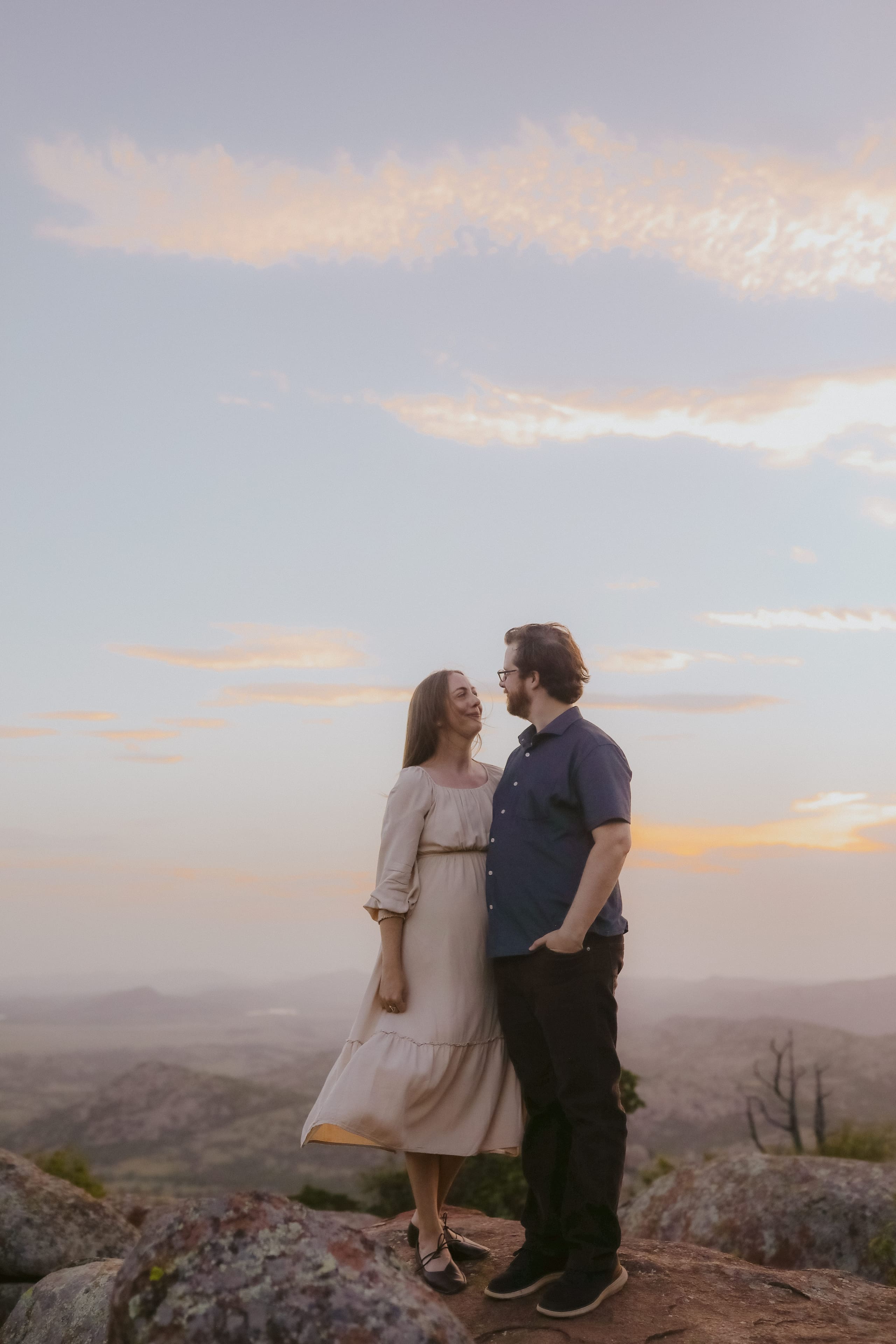 A quiet look shared on the mountaintop at sunset