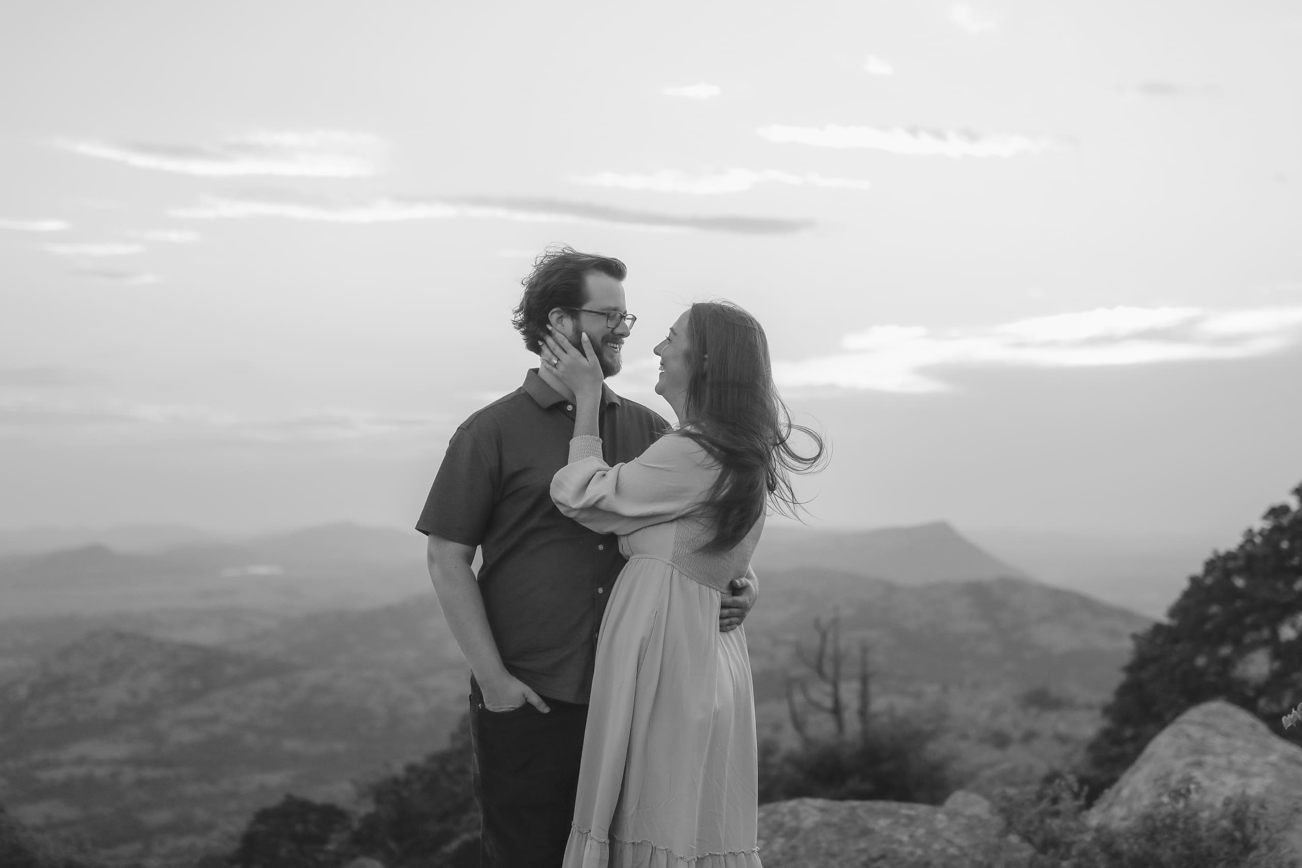 A windswept embrace above the valley in black and white