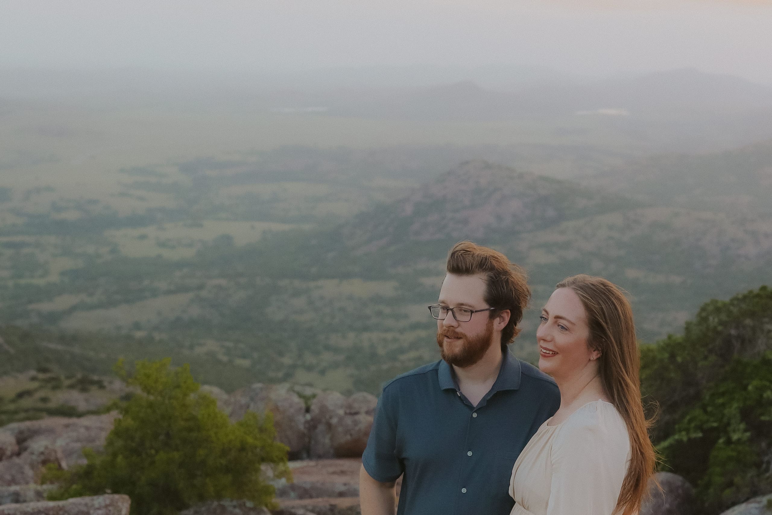 Side by side on the mountaintop, gazing out over the hazy valley