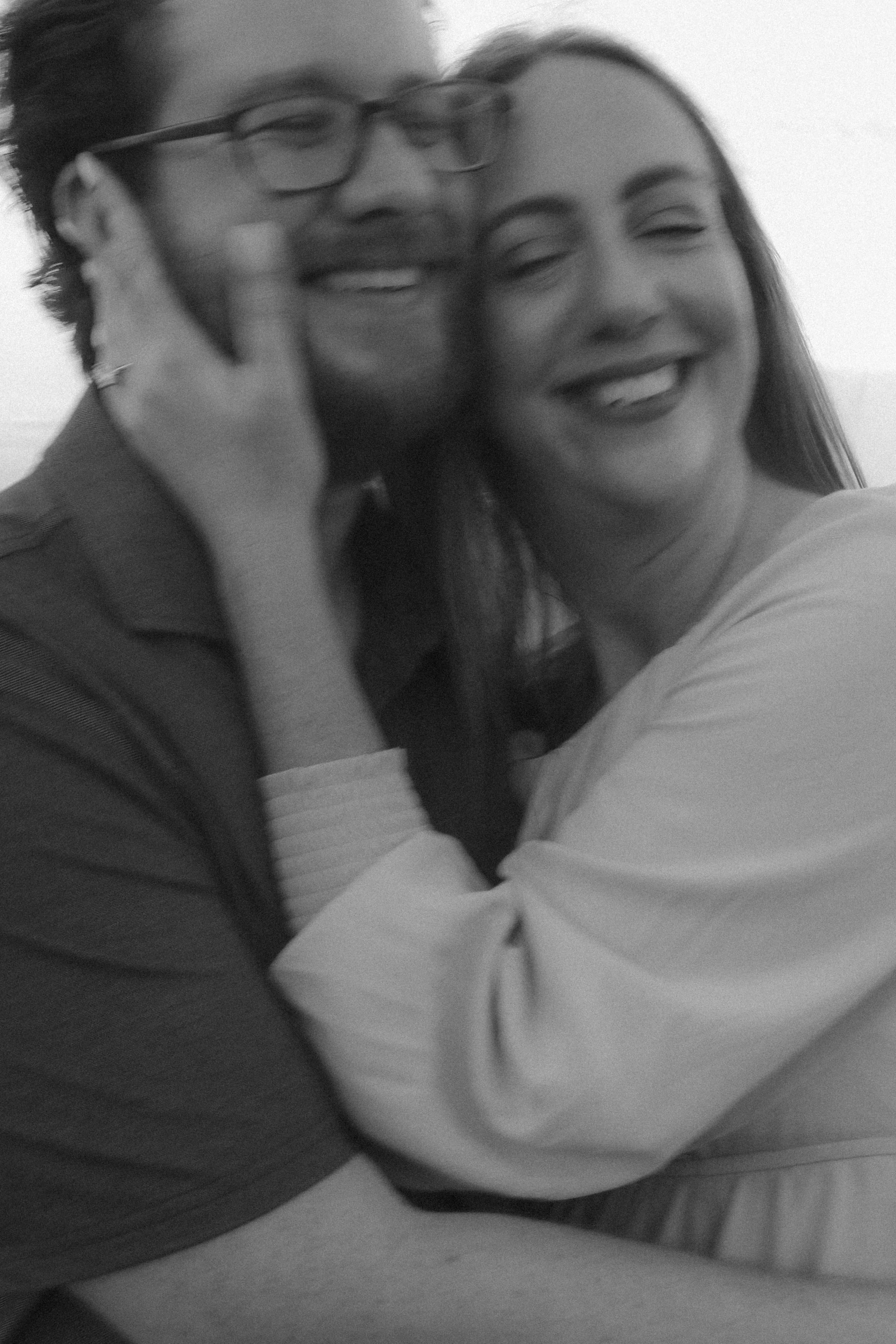 Cheek to cheek and beaming, in black and white