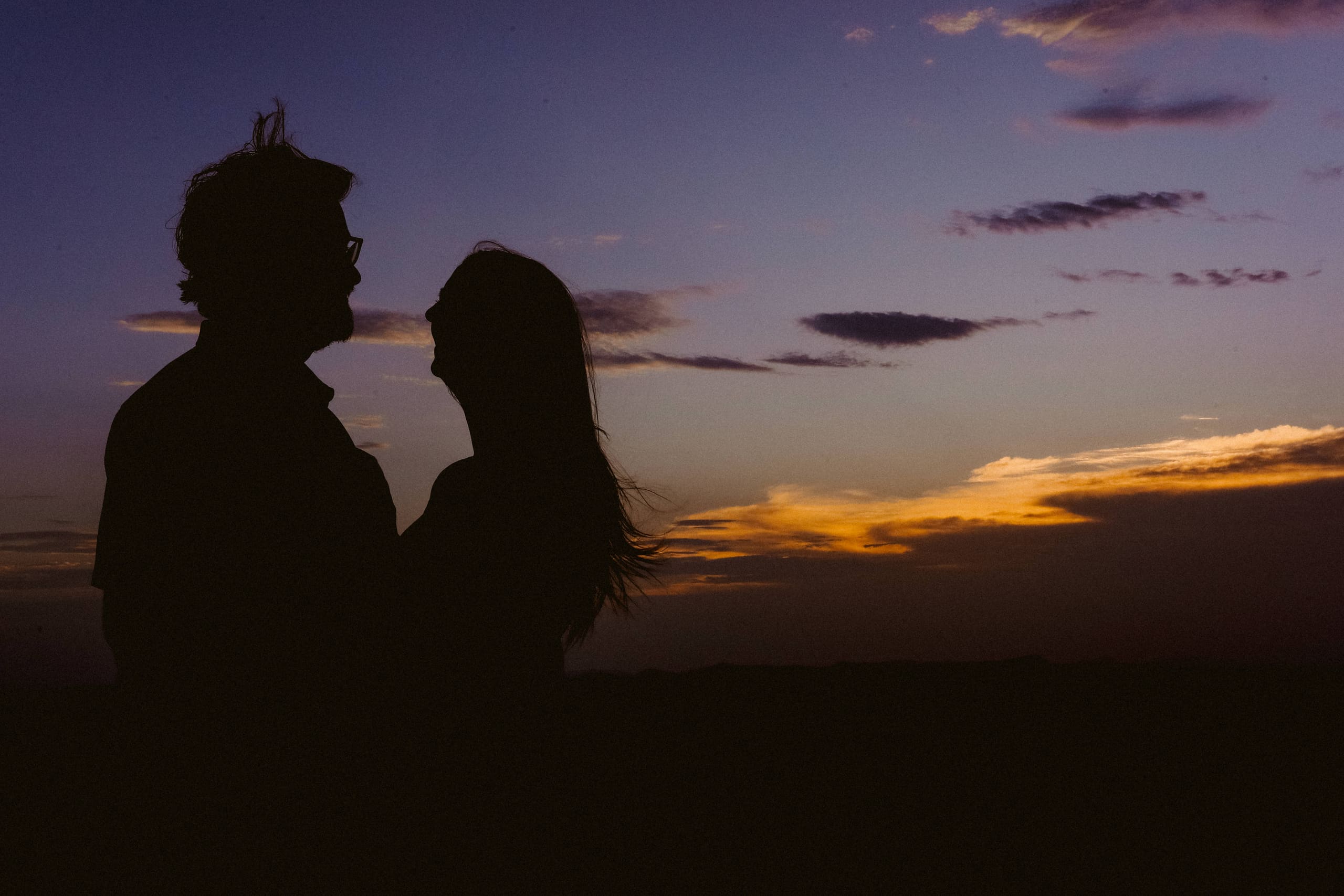 Silhouettes at nightfall, the sunset’s last gold low on the horizon