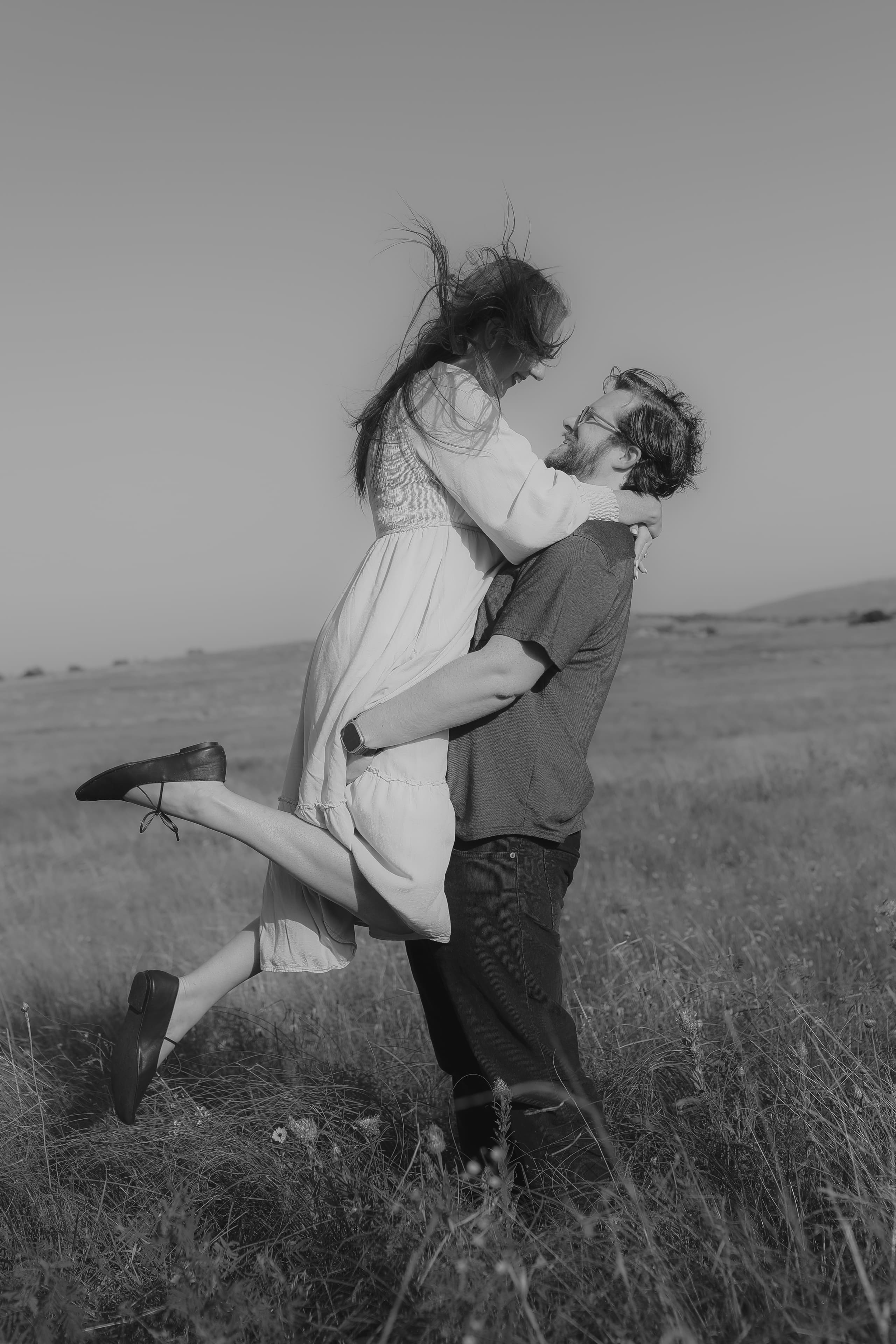 Lifted close in the open field, one foot kicked back — in black and white