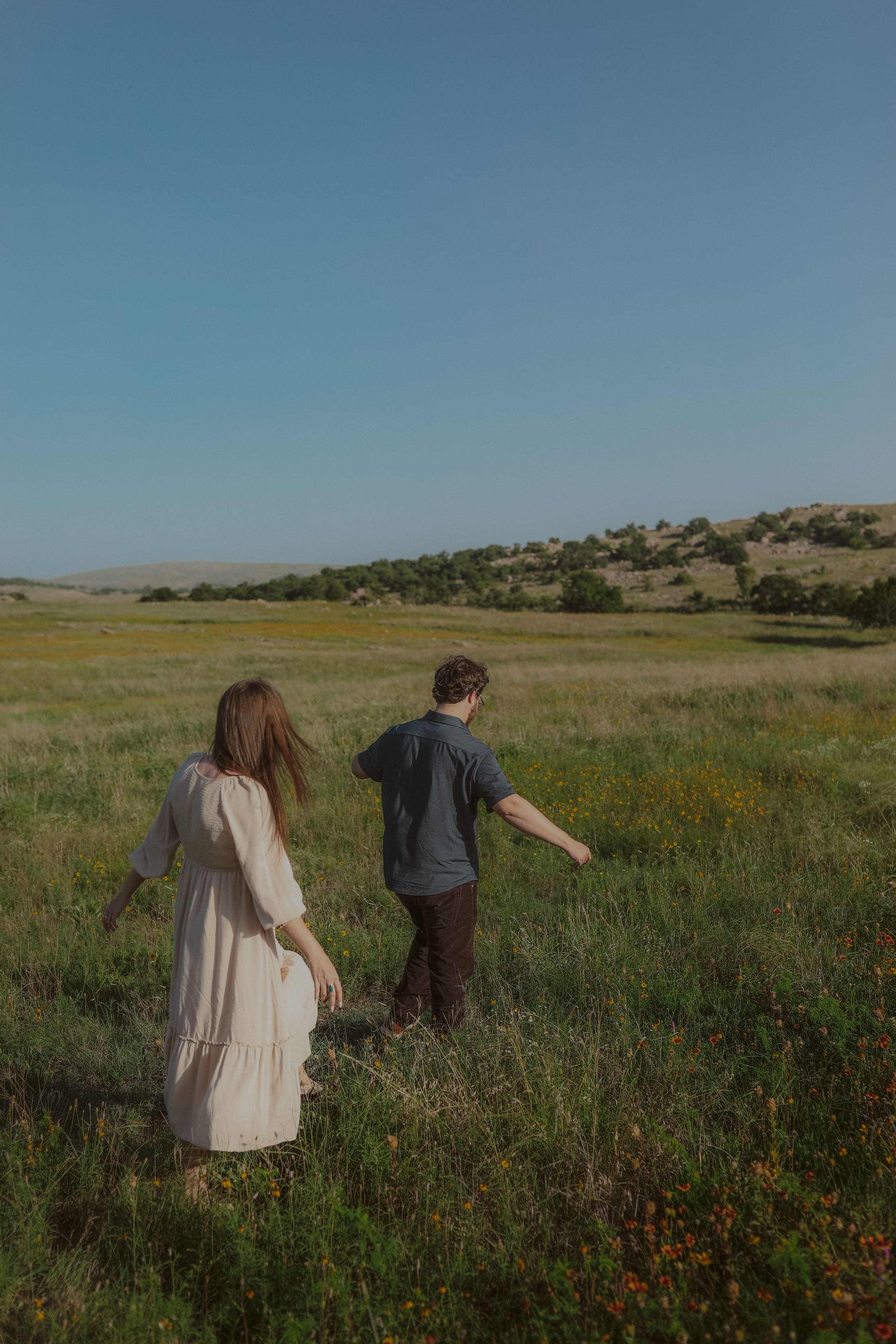 Wandering through the meadow together toward the far hills