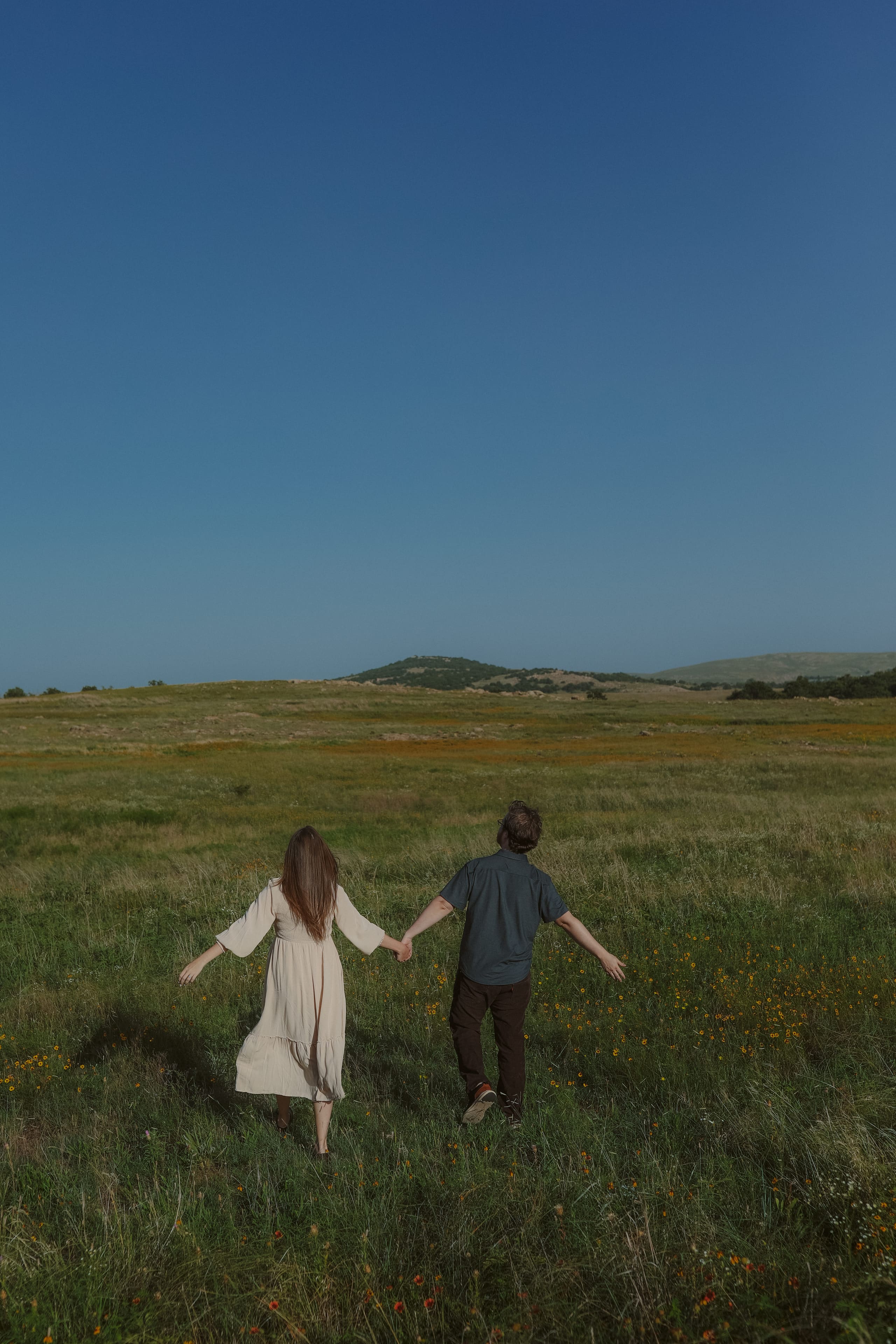 Walking away hand in hand into the open prairie